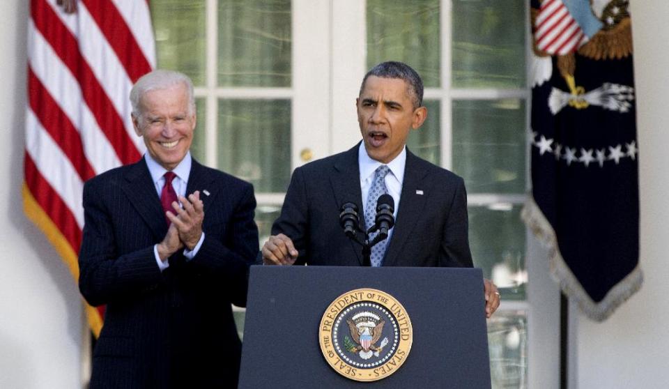 President Barack Obama, with Vice President Joe Biden, speaks in the Rose Garden of the White House in Washington, Tuesday, April 1, 2014, about the Affordable Care Act. The deadline to sign up for health insurance under the Affordable Care Act passed at midnight Monday night. (AP Photo/Carolyn Kaster)