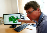 Juergen Schwarzensteiner, factory manager of "Poschinger Bray'sche Gueterverwaltung", explains the "talking fields" biomass map on a computer in Irlbach near Deggendorf, Germany, April 21, 2016. REUTERS/Michaela Rehle