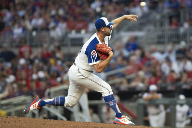 Atlanta Braves' Brian Jordan throws the ball toward the infield