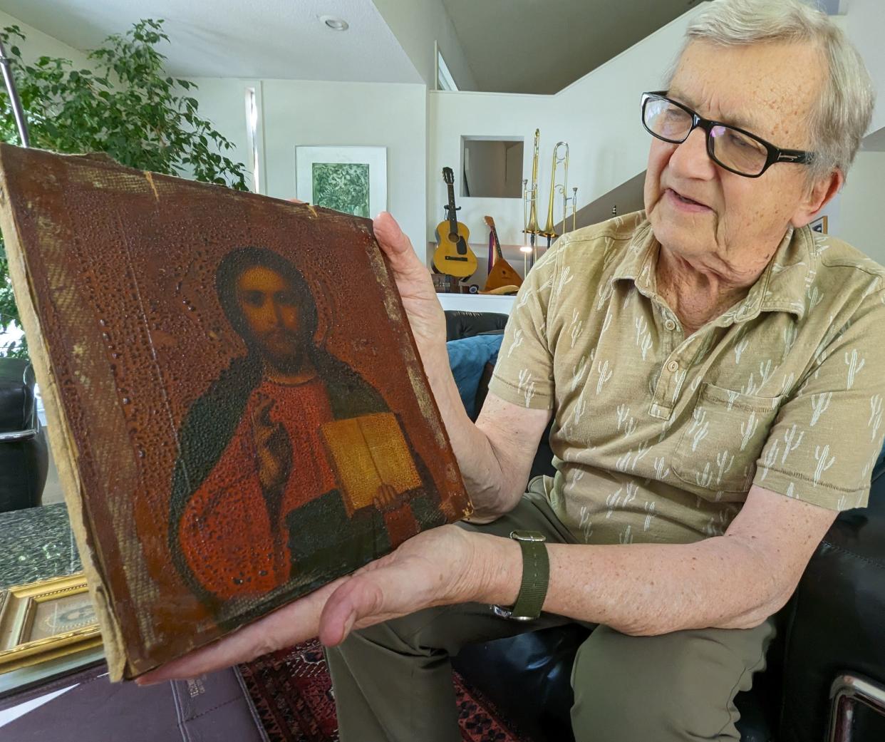 This religious icon, a very old painting of Jesus, was a family heirloom cherished by Bill Nowysz’s mother, who smuggled it out of Poland after World War II. He said axe marks toward the top of the painting show his mother’s attempt to destroy it at one point rather than have it confiscated. He said when it failed to split, she saw that as a sign to protect it at all costs.