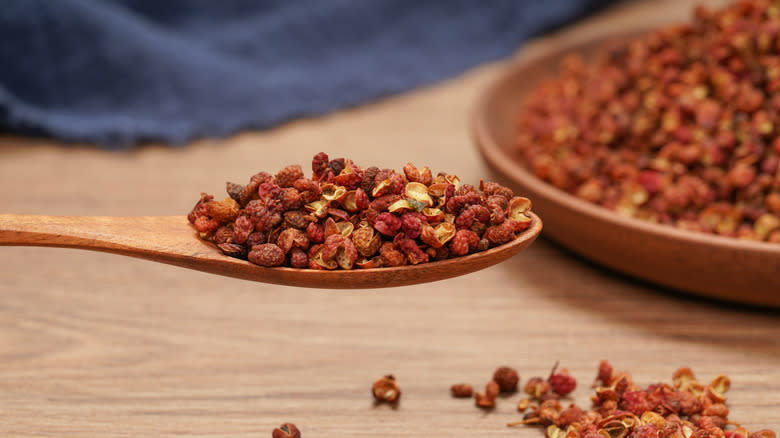 Sichuan peppers on wooden spoon