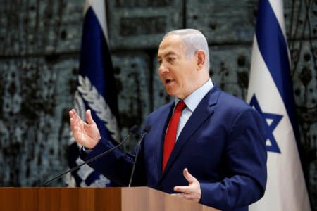 FILE PHOTO: Israeli Prime Minister Benjamin Netanyahu speaks during a ceremony whereby Amir Yaron is sworn in as Bank of Israel governor, in Jerusalem December 24, 2018. REUTERS/Amir Cohen/File Photo