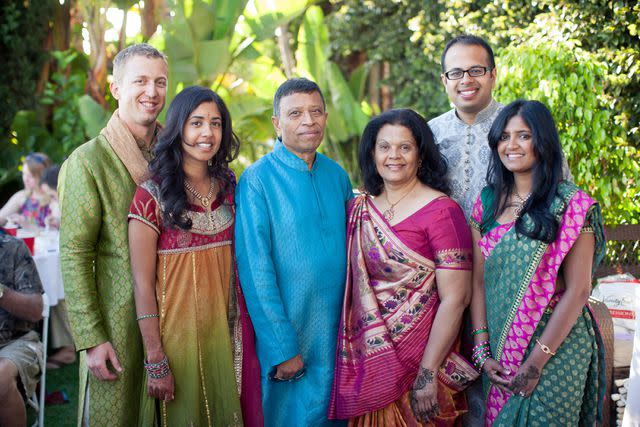 <p>Courtesy of Avni Shah/ InStyle</p> Avni with her parents, brother, and sister-in-law at the traditional henna party (mehndi) to celebrate her wedding.