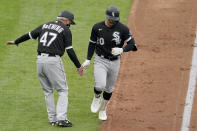 Chicago White Sox's Danny Mendick (20) celebrates with third base coach Joe McEwing (47) after hitting a two-run home run during the first inning of a baseball game against the Kansas City Royals Saturday, May 8, 2021, in Kansas City, Mo. (AP Photo/Charlie Riedel)