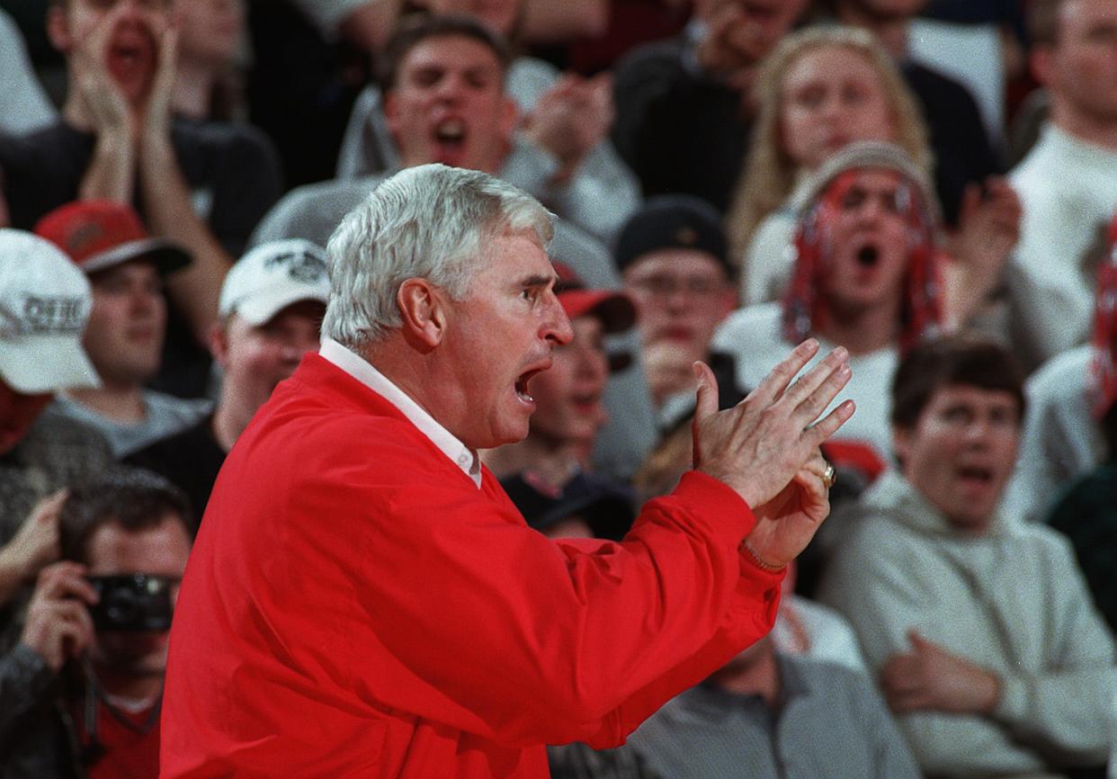 Indiana coach Bobby Knight screams for a time out, then throws one of his trademark tantrums in the first half of play at St. John Arena. Knight had called for a time out and officials did not see him and did not give the Hoosiers a time out. Knight threw a fit. Indiana won anyway.