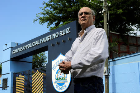 Journalist Carlos Fernando Chamorro, critic of the government of President Daniel Ortega stands in front of the main entrance of police headquarters in Managua, Nicaragua December 15, 2018.REUTERS/Oswaldo Rivas