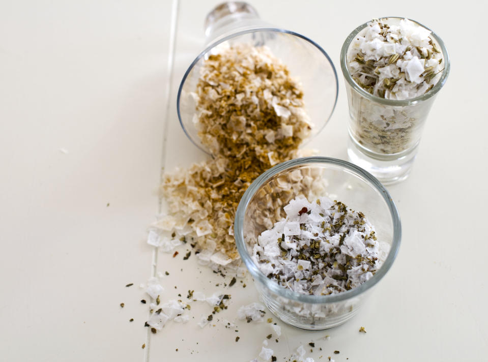 In this image taken on Oct. 22, 2012, savory salt combinations from top left clockwise, curry, fennel seed and oregano are shown in Concord, N.H. (AP Photo/Matthew Mead)