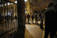 Students line up for free food aid organized by Linkee, a Paris-based company collecting food waste, in Paris, Monday, Feb. 1, 2021. The pandemic has devastated economies the world over. In France, the economic fallout has weighed particularly heavily on young people — and their woes have only been compounded by disruptions to their studies and social interactions. (AP Photo/Christophe Ena)