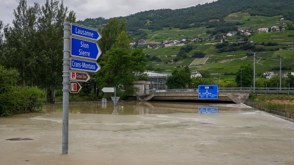 A flooded road near Sierre, western Switzerland, on June 30, 2024. - Boris Heger/AFP/Getty Images