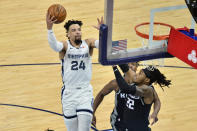 Memphis Grizzlies forward Dillon Brooks (24) shoots against Sacramento Kings center Richaun Holmes (22) in the first half of an NBA basketball game Thursday, May 13, 2021, in Memphis, Tenn. (AP Photo/Brandon Dill)