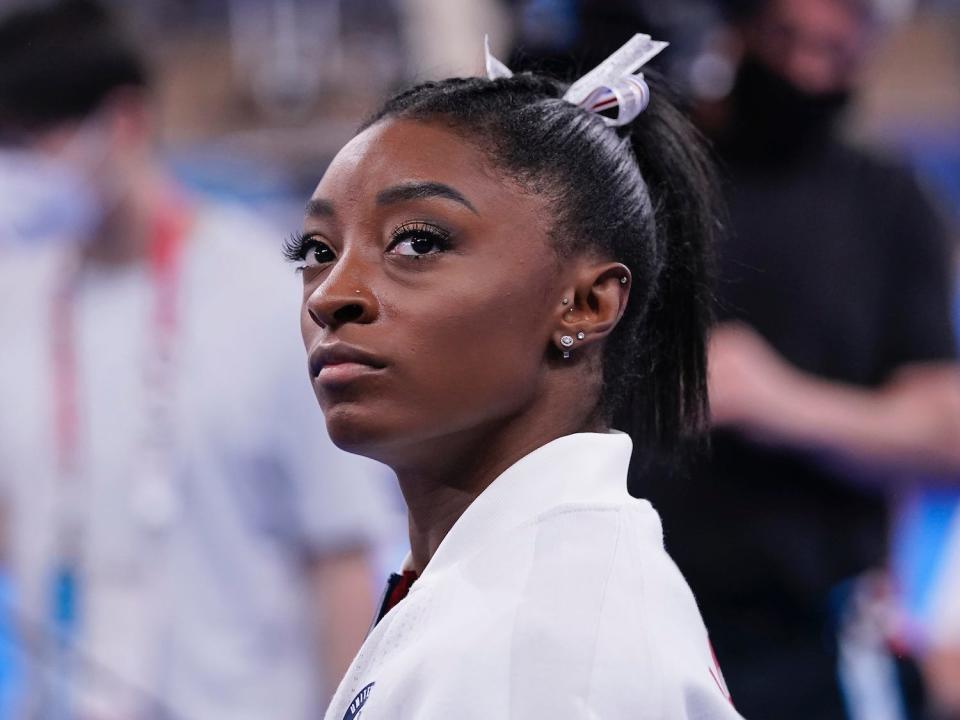 Simone Biles looks on during the Tokyo Olympics.