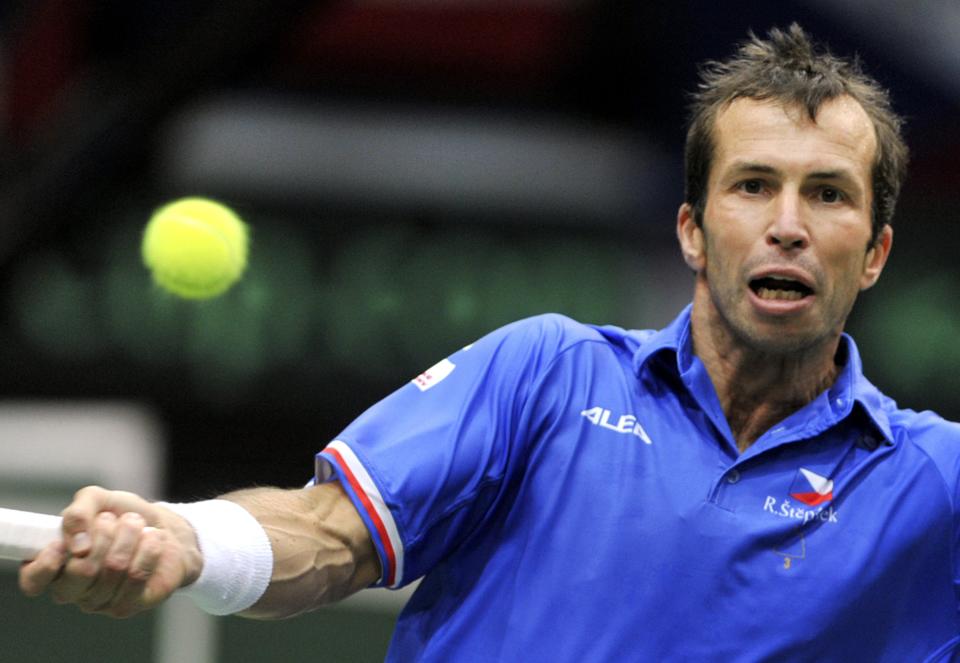 Radek Stepanek from the Czech Republic returns the ball to Robin Haase from the Netherlands during their opening single of the tennis Davis Cup first round match in Ostrava, Friday, Jan. 31, 2014. (AP Photo/CTK, Jaroslav Ozana) SLOVAKIA OUT