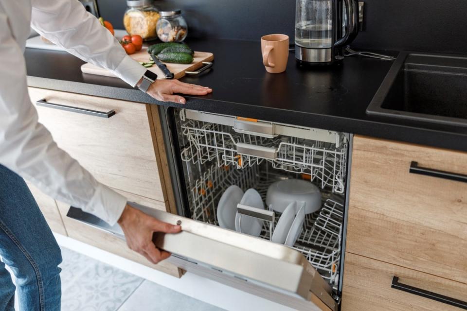 Person opening dishwasher.