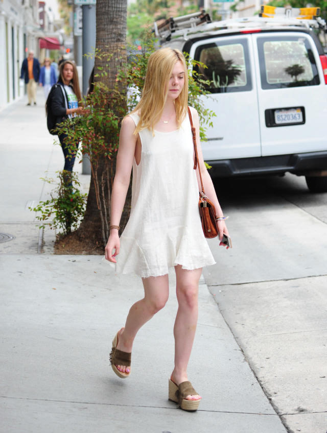 Spotted in LA, actress Elle Fanning with a Gucci Blooms printed Dionysus  bag and wearing a pair…