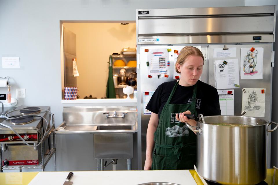 Katy Roberts, of CinSoy, prepares miso soup for lunch as part of the Soup and Stories event held by the Welcome Project in Camp Washington on Wednesday, July 20, 2022. The soup is prepared by local chefs to serve for free as part of the Soup and Stories event.