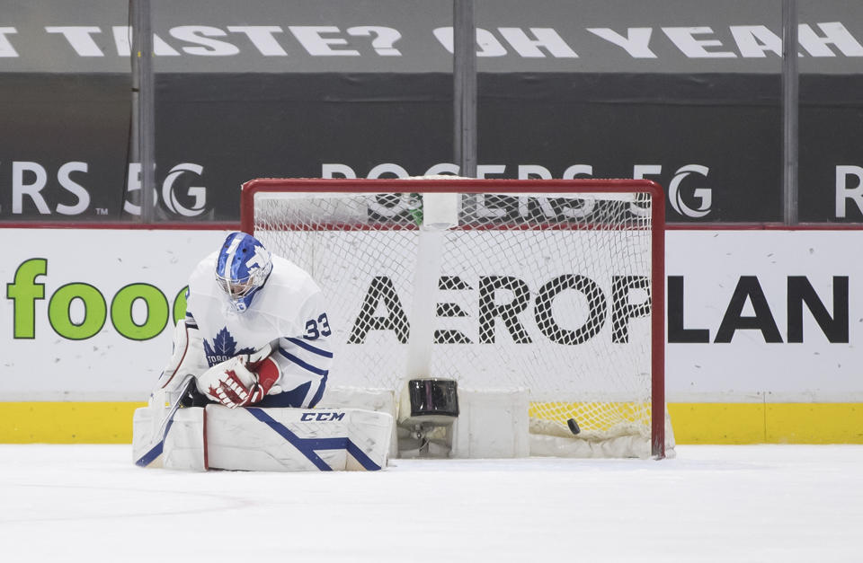 Toronto Maple Leafs goalie David Rittich, of the Czech Republic, allows a goal to Vancouver Canucks' Nils Hoglander during the third period of an NHL hockey game in Vancouver, British Columbia on Tuesday, April 20, 2021. (Darryl Dyck/The Canadian Press via AP)