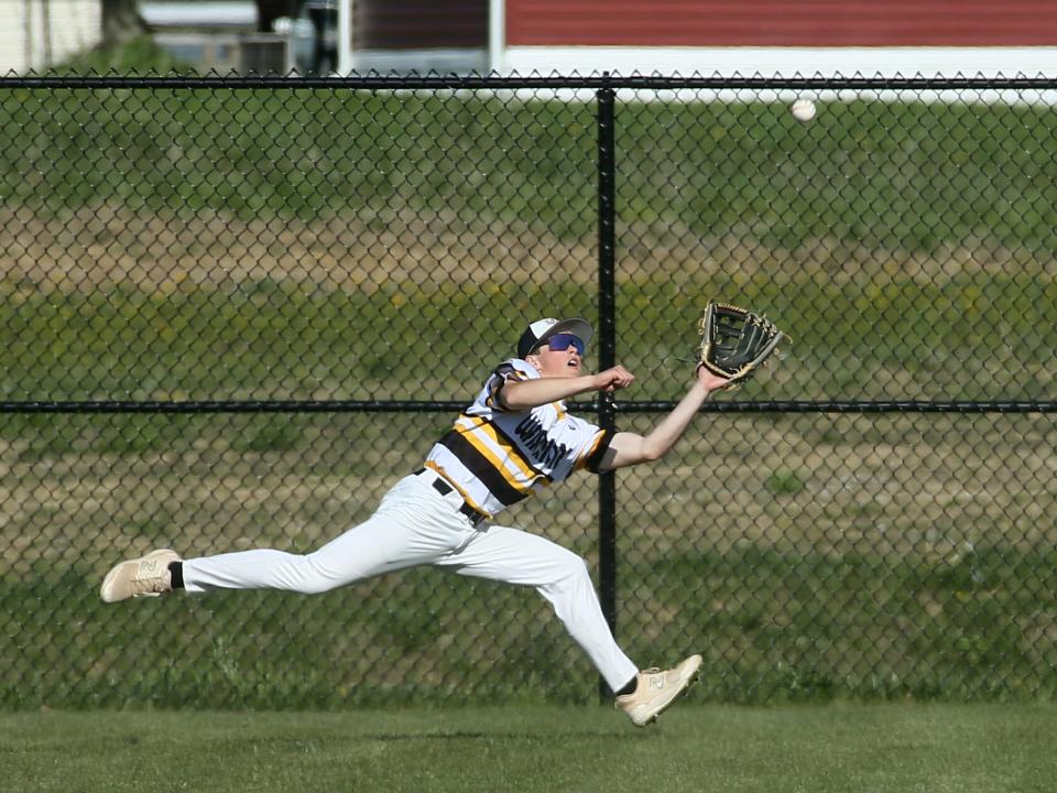 Watkins Memorial right fielder A.J. Langwasser catches a fly ball in foul territory against Licking Valley on Monday.