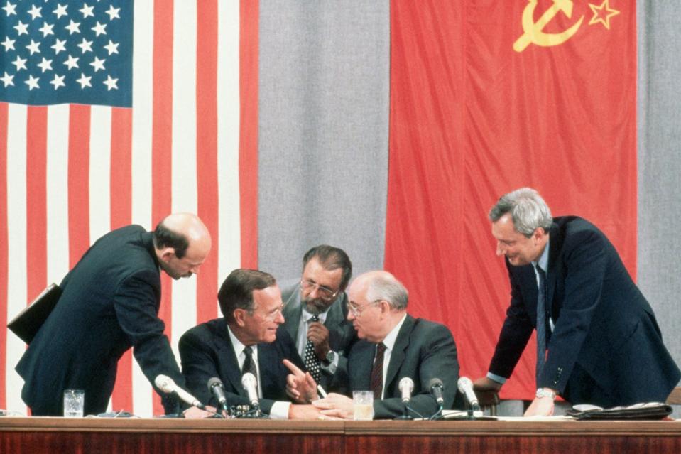 U.S. President George Bush and Soviet leader Mikhail Gorbachev laugh together during a 1991 meeting in Moscow. <a href="https://media.gettyimages.com/photos/president-george-bush-and-soviet-leader-mikhail-gorbachev-laugh-at-a-picture-id635228493" rel="nofollow noopener" target="_blank" data-ylk="slk:Peter Turnley/Corbis/VCG via Getty Images;elm:context_link;itc:0;sec:content-canvas" class="link ">Peter Turnley/Corbis/VCG via Getty Images</a>