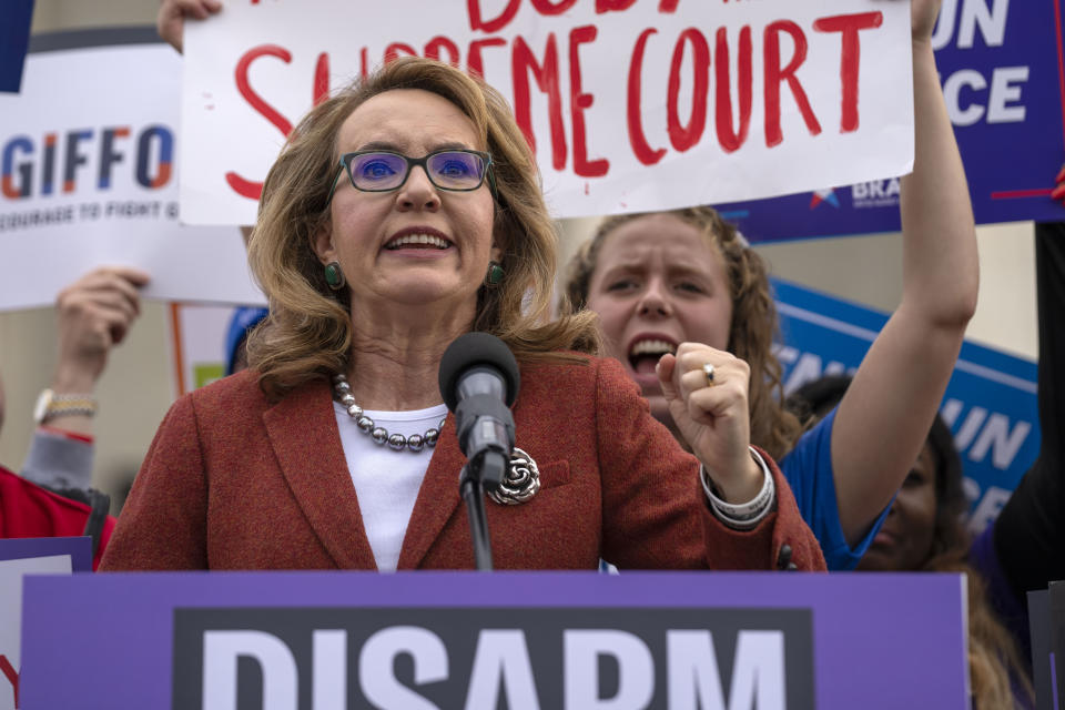 Former Congresswoman Gabrielle Giffords speaks outside the Supreme Court on Tuesday, Nov. 7, 2023, in Washington. The Supreme Court is taking up a challenge to a federal law that prohibits people from having guns if they are under a court order to stay away from their spouse, partner or other family members. (AP Photo/Mark Schiefelbein)