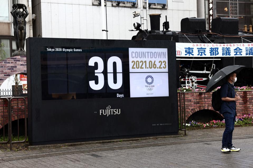 The countdown clock for the Tokyo 2020 Olympic Games is displayed, 30 days before the opening ceremony, in Tokyo, Japan, June 23, 2021. / Credit: BEHROUZ MEHRI/AFP/Getty