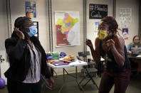 "It hasn't sunk in, I went to sleep crying tears of joy," said Kristine Hendrix, right, describes her feelings to Cori Bush after first learning that Bush defeated U.S. Rep. William Lacy Clay Tuesday night, during a visit to her campaign headquarters in Northwoods, Mo., on Wednesday, Aug. 5, 2020. Bush defeated Clay to take the Democratic nomination for Missouri's 1st Congressional District. (Robert Cohen/St. Louis Post-Dispatch via AP)