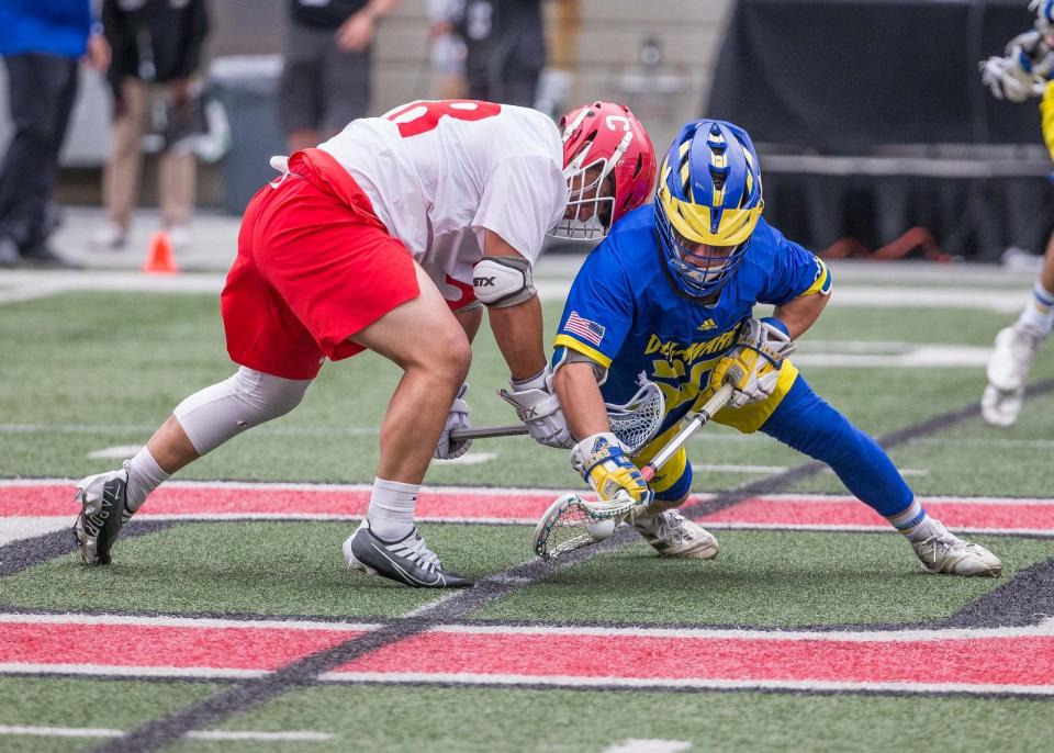 Delaware's Logan Premtaj fights for a face-off win in Sunday's NCAA Lacrosse Tournament quarterfinal against Cornell at Ohio Stadium.