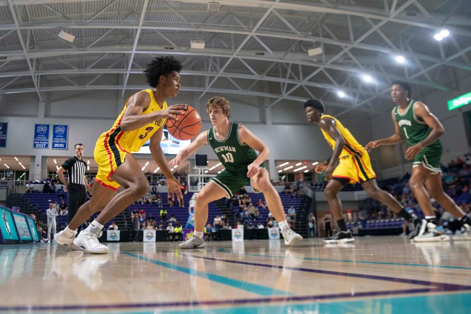 Oak Hill Academy's Caleb Foster (3) catches the ball on the perimeter during the 2021 City of Palms Classic game between Oak Hill Academy and Isidore Newman, Saturday, Dec. 18, 2021, at Suncoast Credit Union Arena in Fort Myers, Fla.Oak Hill Academy defeated Isidore Newman 82-48.