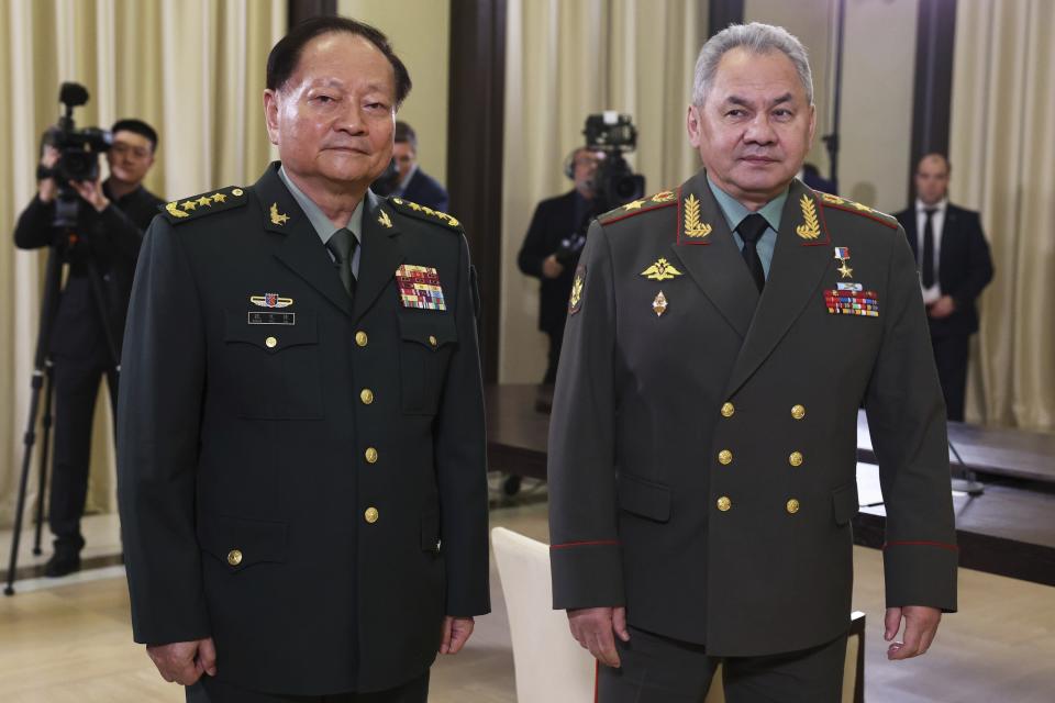 Gen. Zhang Youxia, vice chairman of China's Central Military Commission, left, and Russian Defense Minister Sergei Shoigu arrive to attend the talks with Russian President Vladimir Putin at the Novo-Ogaryovo residence outside Moscow, Russia, Wednesday, Nov. 8, 2023. (Sergei Bobylev, Sputnik, Kremlin Pool Photo via AP)