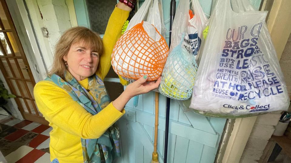 Angela Vnoucek with bags of rubbish