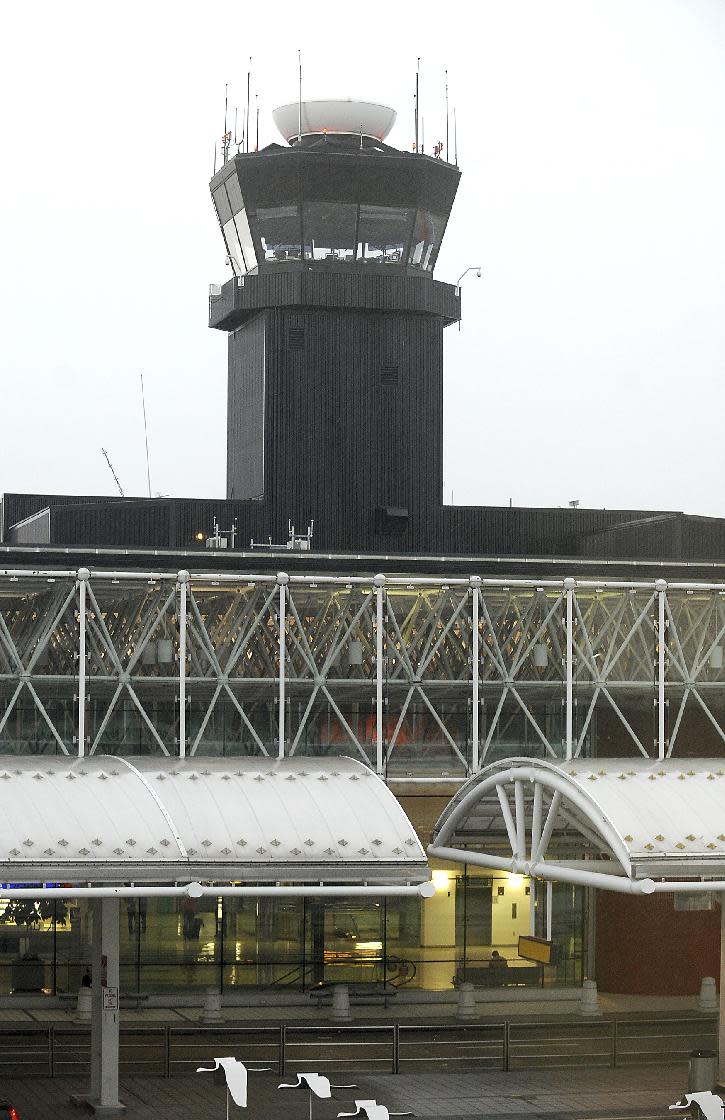 In this Thursday, Sept. 12, 2013 photo, the control tower at Baltimore-Washington International Thurgood Marshall Airport, in Linthicum, Md., is seen. A lightning strike on the tower, which also injured an air traffic controller, is prompting the Federal Aviation Administration to examine hundreds of air traffic control towers nationwide, the agency told The Associated Press. Officials will be looking for problems with the systems that protect the towers from lightning strikes. (AP Photo/The Capital, Paul W. Gillespie)