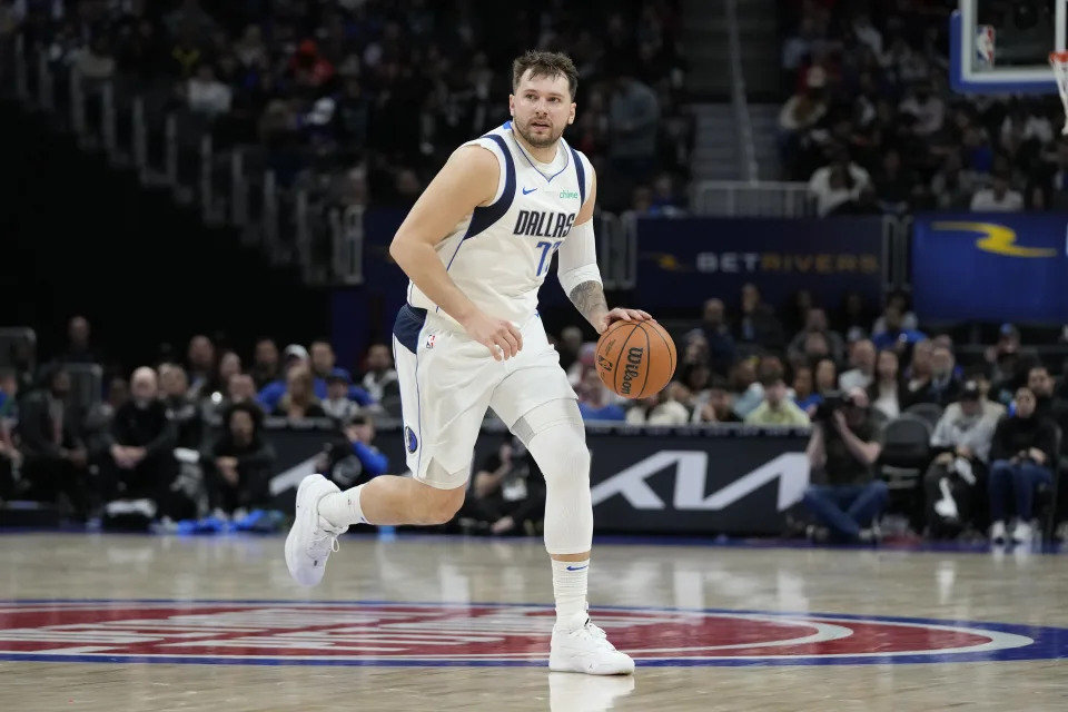 Dallas Mavericks guard Luka Doncic brings the ball up court during the second half of an NBA basketball game against the Detroit Pistons, Saturday, March 9, 2024, in Detroit. (AP Photo/Carlos Osorio)