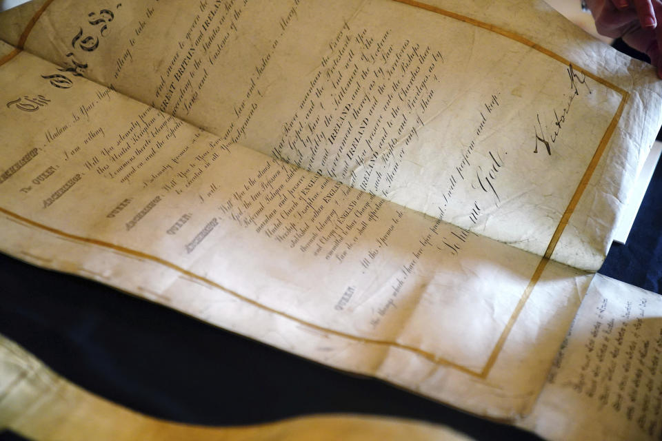 The Coronation Roll of Queen Victoria on display at Buckingham Palace, central London before King Charles III and Queen Camilla are presented with their own Coronation Roll, an official record of their Coronation, Wednesday May 1, 2024. (King Charles III gaped at the 70-foot-long (21.4-meter) hand-lettered scroll as it was presented to him earlier this week at Buckingham Palace, thanking the artisans who produced the document that serves as the official record of his coronation almost a year ago. (Victoria Jones/PA via AP)