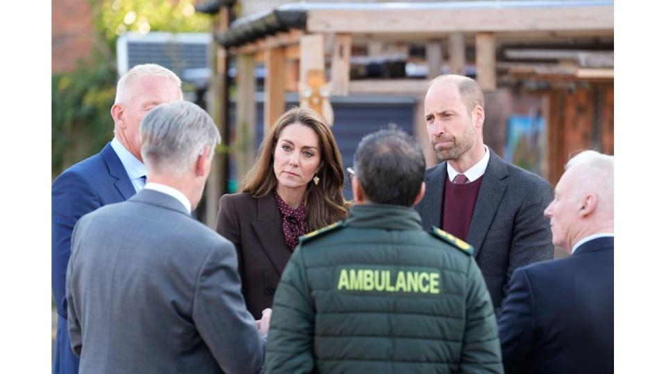 Prince William and Kate Middleton speak to members of the emergency services 