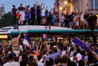 <p>People celebrate France’s victory in central Paris on July 10, 2018 after the final whistle of the Russia 2018 World Cup semi-final football match between France and Belgium. (Photo by Thomas SAMSON / AFP) </p>