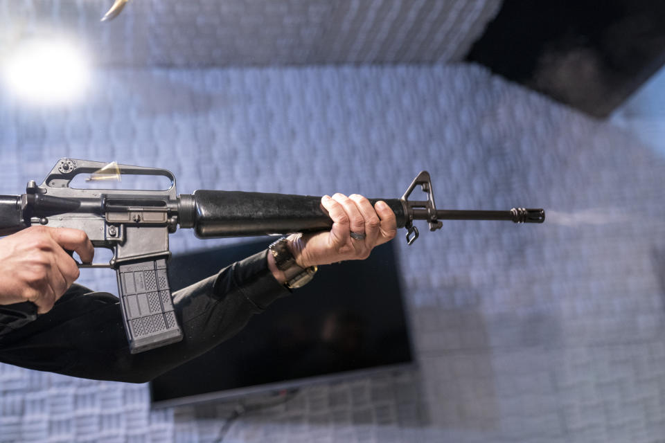 Two empty shell casings fly as a fully automatic M-16 is fired at the Bureau of Alcohol, Tobacco, Firearms, and Explosives (ATF), National Services Center, Thursday, March 2, 2023, in Martinsburg, W.Va. Machine guns have been illegal in the U.S. for decades, but in recent years the country has seen a new surge of weapons capable of automatic fire. Small pieces of plastic or metal used to convert legal guns into homemade machine guns are helping to fuel gun violence. (AP Photo/Alex Brandon)