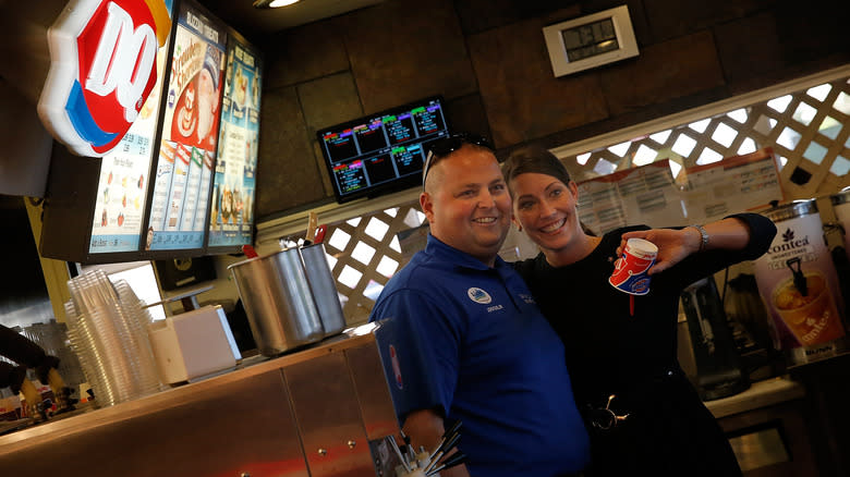 Woman holding a Blizzard upside down