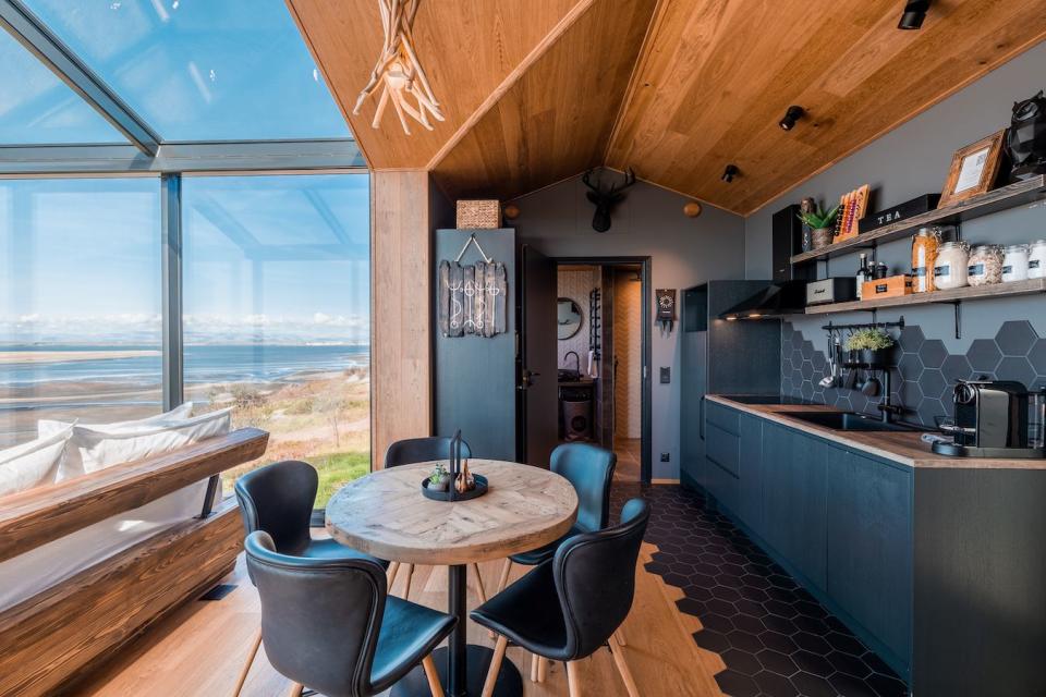 a kitchen with a table and chairs