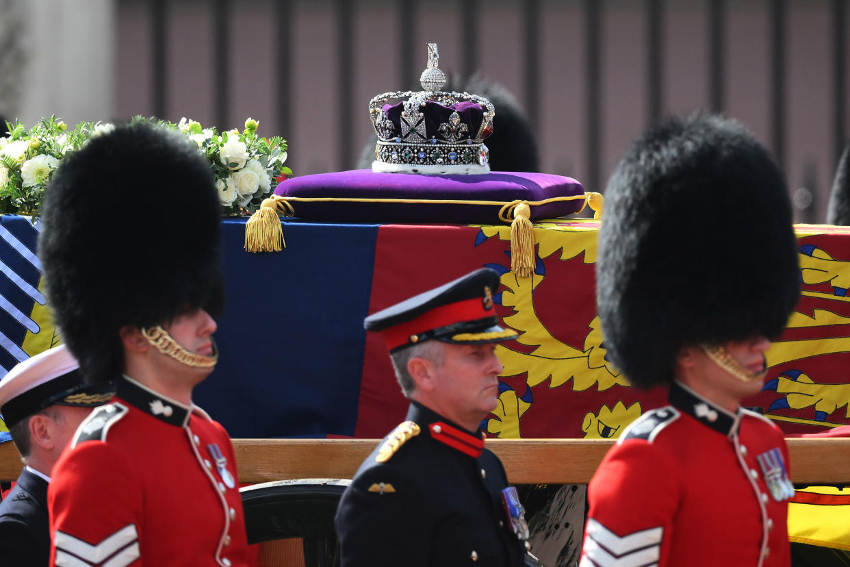 LONDON, ENGLAND - SEPTEMBER 14: The gun carriage bearing the coffin of the late Queen Elizabeth II departs Buckingham Palace, transferring the coffin to The Palace of Westminster on September 14, 2022 in London, United Kingdom. Queen Elizabeth II's coffin is taken in procession on a Gun Carriage of The King's Troop Royal Horse Artillery from Buckingham Palace to Westminster Hall where she will lay in state until the early morning of her funeral. Queen Elizabeth II died at Balmoral Castle in Scotland on September 8, 2022, and is succeeded by her eldest son, King Charles III. (Photo by Daniel Leal - Pool/Getty Images)