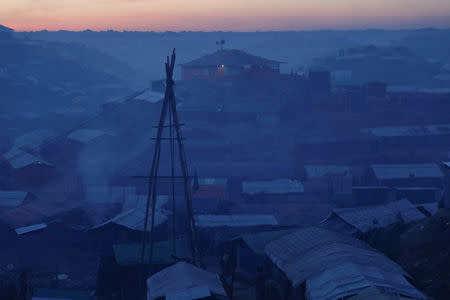 A makeshift mosque is seen on a hill near the camp for widows and orphans at the Balukhali camp for Rohingya refugees near Cox's Bazar, Bangladesh, December 5, 2017. More than 230 women and children live at a so-called widows camp built by fellow refugees with the help of donor funds for Rohingya widows and orphans to offer them better protection and shelter. REUTERS/Damir Sagolj