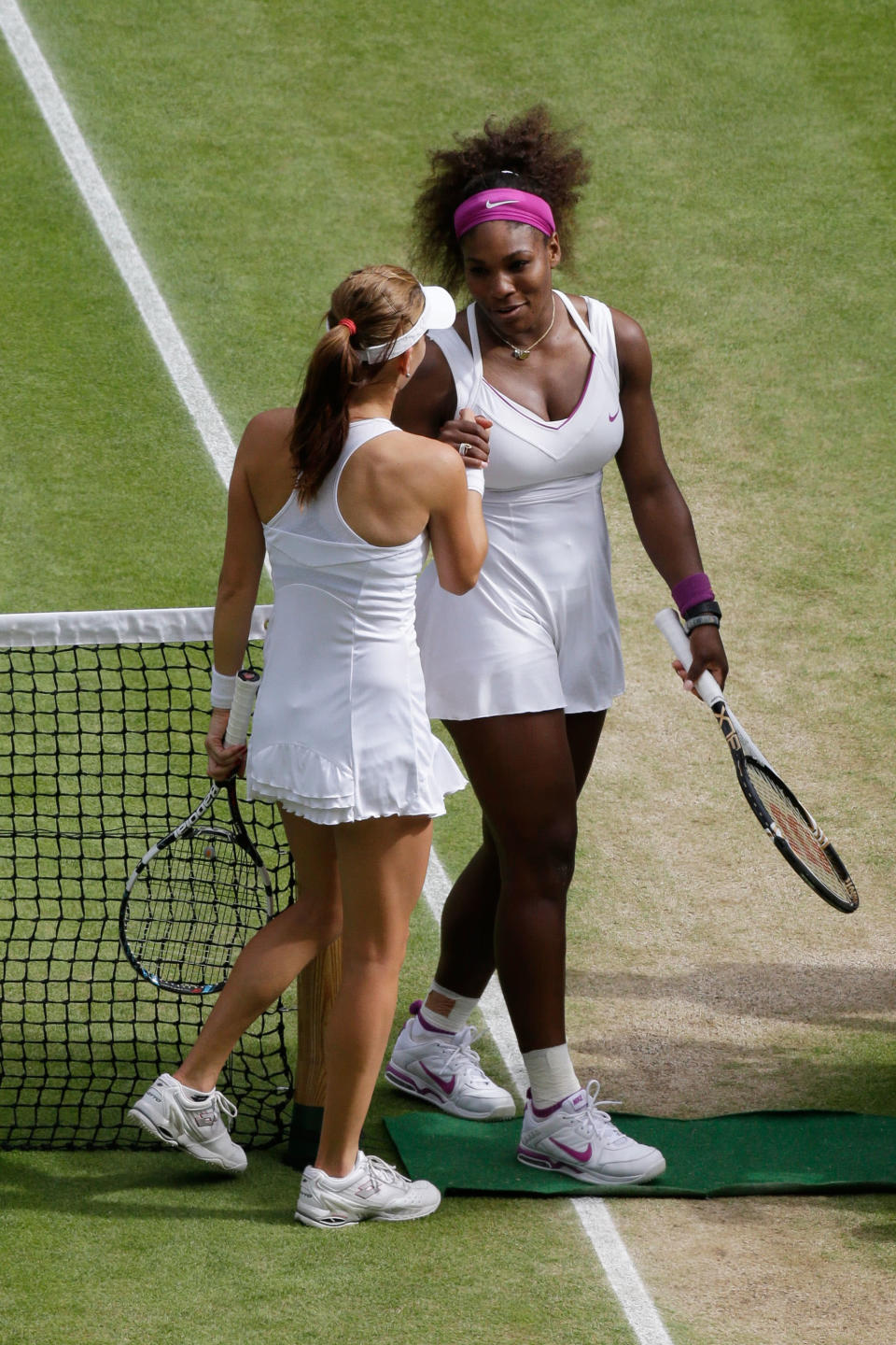 Serena Williams of the USA is congratulated by Agnieszka Radwanska of Poland after her Ladies Singles final match on day twelve of the Wimbledon Lawn Tennis Championships at the All England Lawn Tennis and Croquet Club on July 7, 2012 in London, England. (Photo by Anja Niedringhaus/Pool/Getty Images)