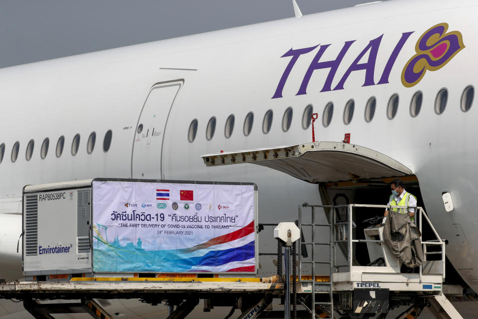 The first shipments of the Sinovac vaccine are unloaded from a Thai airways flight at Suvarnabhumi airport in Bangkok, Thailand, Wednesday, Feb. 24, 2021. Thailand is scheduled to receive first shipments of 200,000 doses of the Sinovac vaccine and 117,000 doses of the AstraZeneca vaccine on Feb. 24. (AP Photo/Sakchai Lalit)