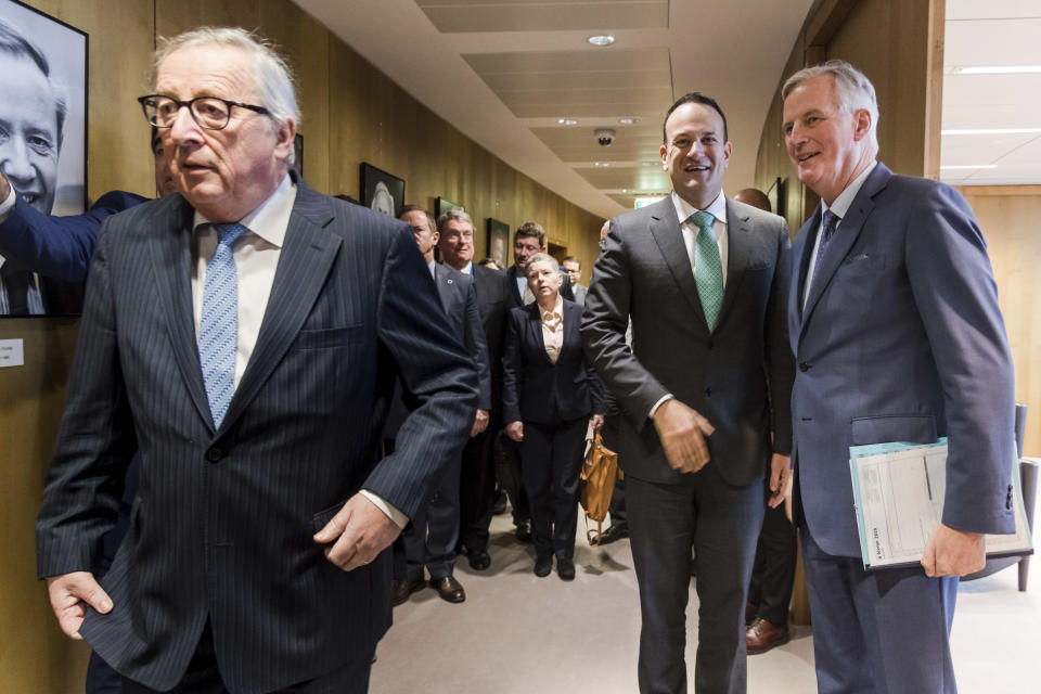 Irish Prime Minister Leo Varadkar, center, greets European Union chief Brexit negotiator Michel Barnier, right, as European Commission President Jean-Claude Juncker, left, walks by before their meeting at the European Commission headquarters in Brussels, Wednesday, Feb. 6, 2019. (AP Photo/Geert Vanden Wijngaert, pool)