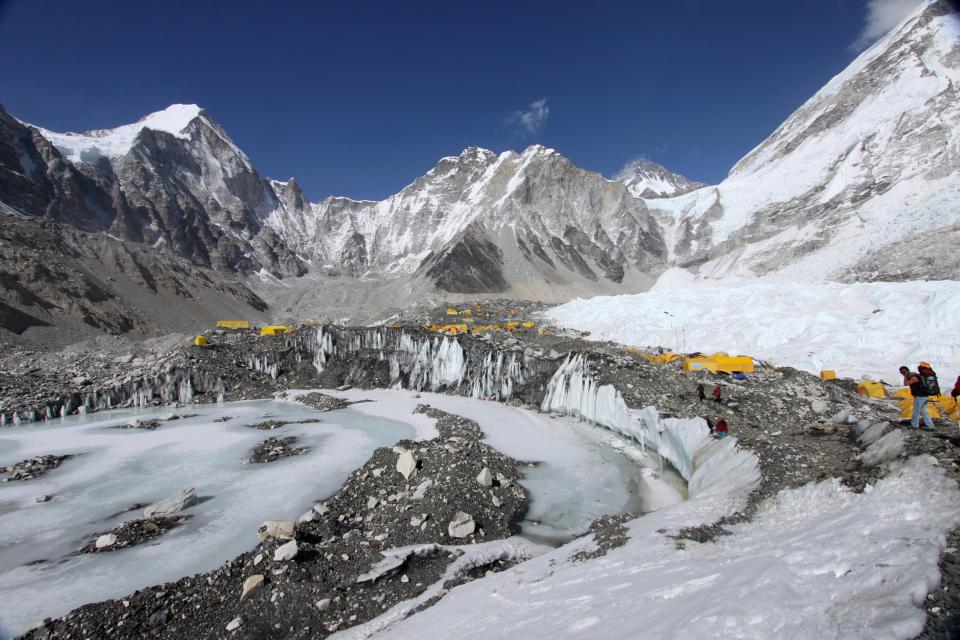 In this April 11, 2015 file photo, tents are seen set up for climbers on the Khumbu Glacier, with Mount Khumbutse, center, and Khumbu Icefall, right, seen in background, at Everest Base Camp in Nepal.