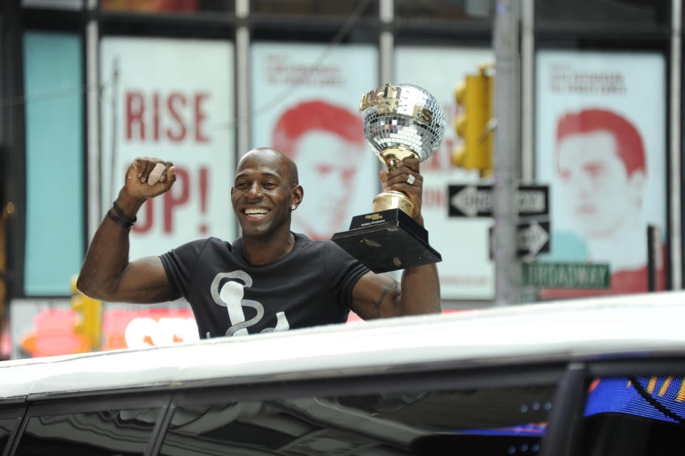 Champ Donald Driver holds up the mirrorball trophy out of the roof of the limo arriving at “GMA’s” Times Square studio.
