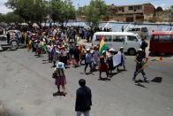 Coca farmers and supporters of Bolivia's ousted President Evo Morales march as they stage a blockade of an entrance to Sacaba