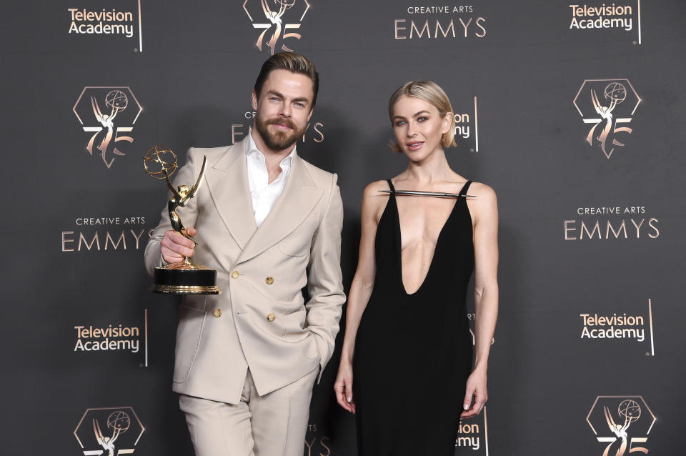 Derek Hough, left, poses with Julianne Hough in the press room after winning the award for outstanding choreography for variety or reality programming for "Dancing With The Stars" during night two of the Creative Arts Emmy Awards on Sunday Jan. 7, 2024, at the Peacock Theater in Los Angeles. (Photo by Richard Shotwell/Invision/AP)