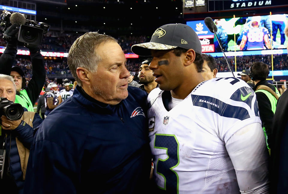 Bill Belichick and Russell Wilson shake hands after a game. 