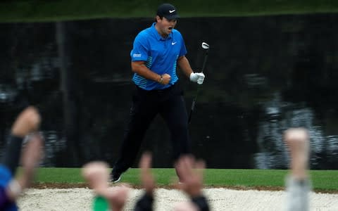 Patrick Reed of the U.S. celebrates chipping in for an eagle on the 15th hole during third round play of the 2018 Masters golf tournament in Augusta - Credit:  REUTERS