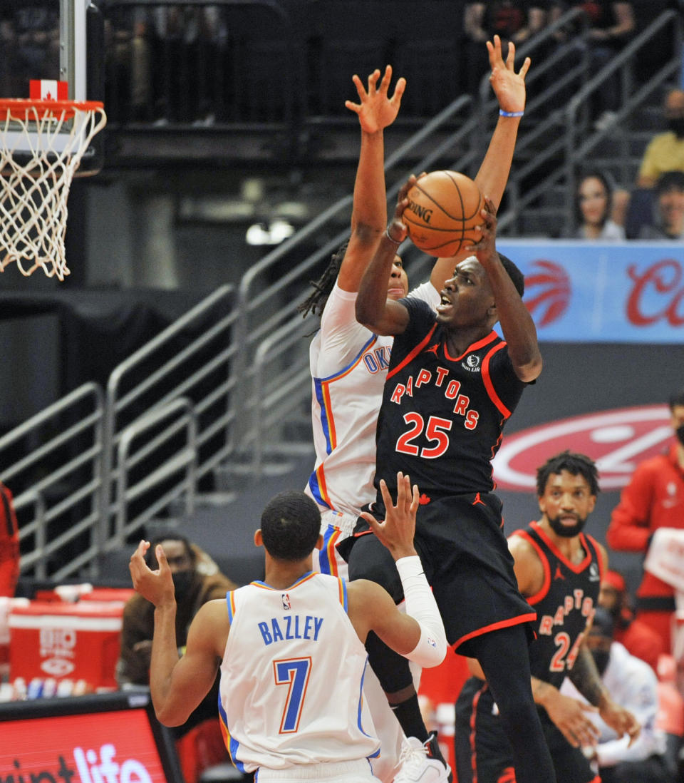 Toronto Raptors' Chris Boucher (25) shoots under pressure from Oklahoma City Thunder's Darius Bazley (7) and Moses Brow, center, during the first quarter of a basketball game Sunday, April 18, 2021, in St. Petersburg, Fla. (AP Photo/Steve Nesius)