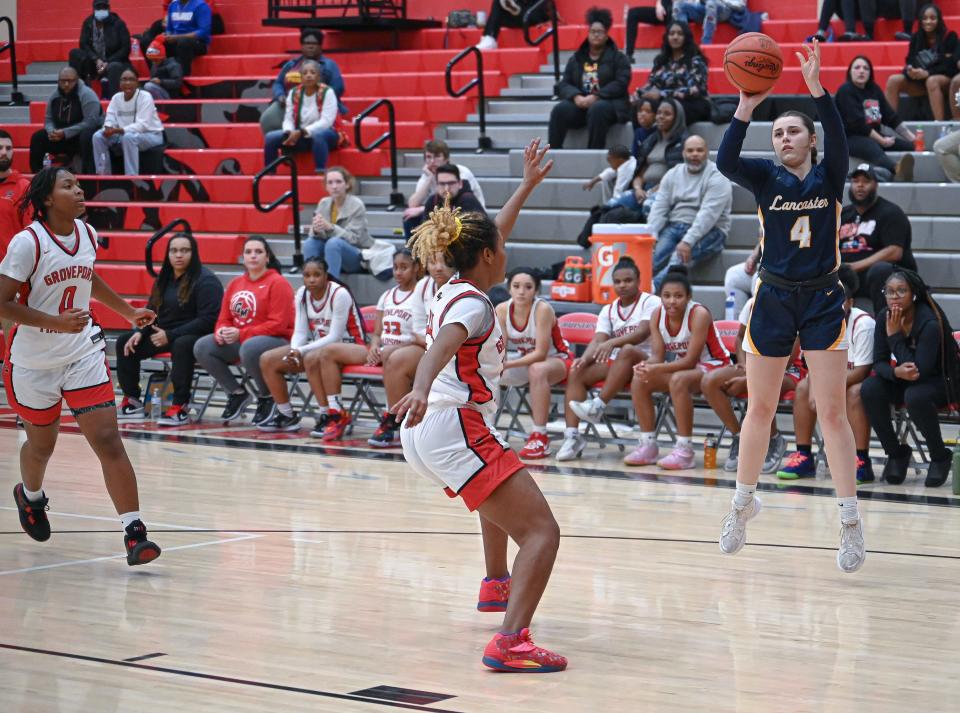 Lancaster junior Chandler Crowell attempts a three-point shot during the first quarter Friday night at Groveport. The Lady Cruisers rallied to win in 65-64 in overtime.